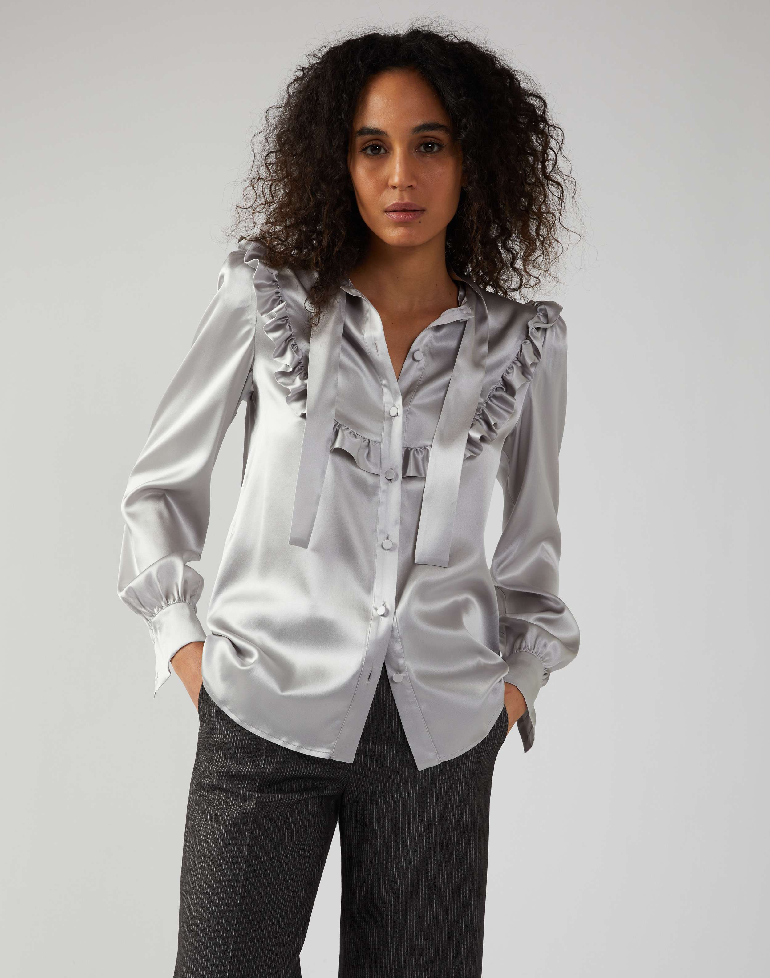 Grey shirt in silk with ruffles and bow detail