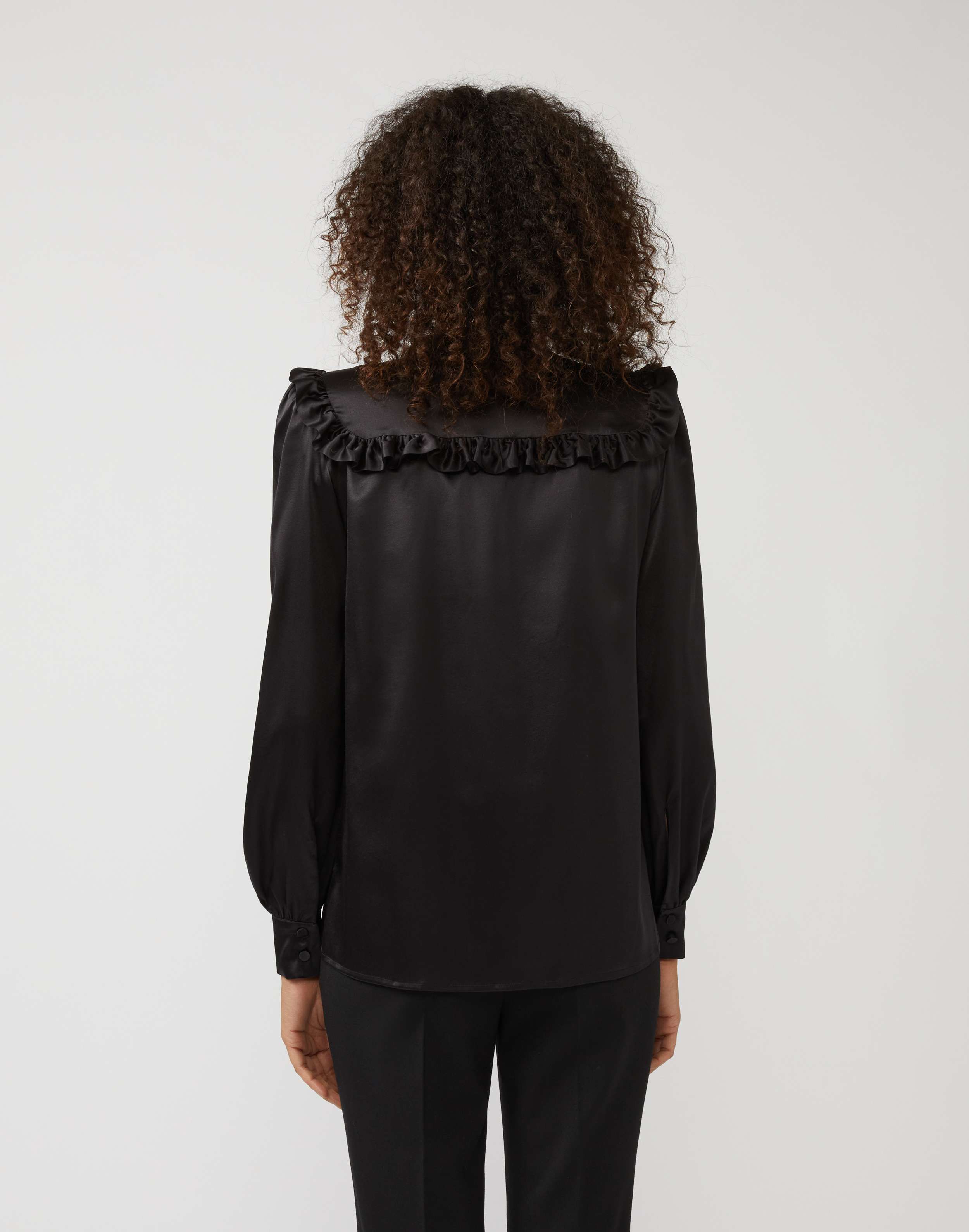 Shirt in black silk with ruffles and bow detail