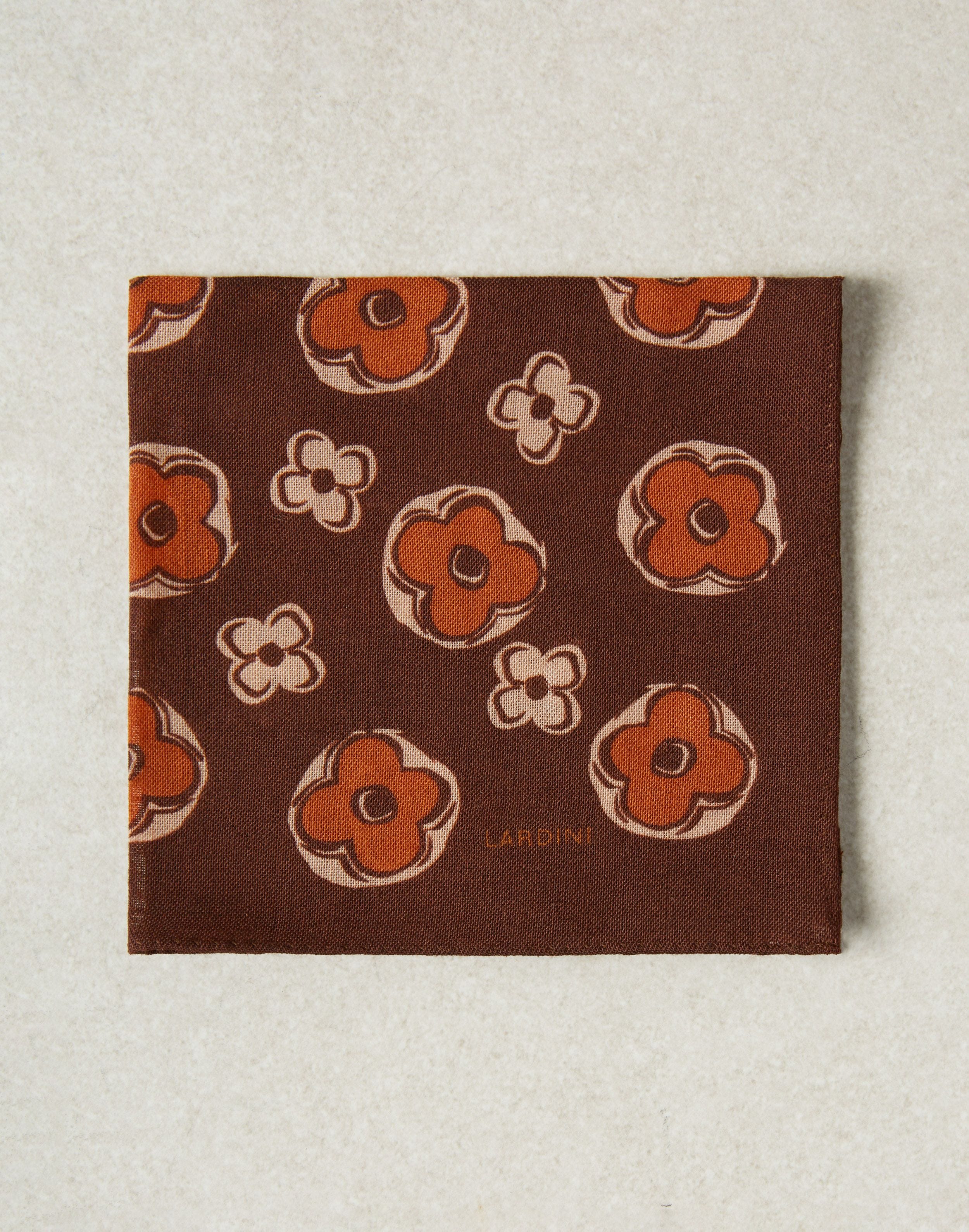 Brown and orange pocket square with a flower print