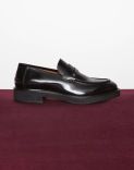 Black calfskin loafers with an apron. 2