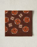 Brown and orange pocket square with a flower print 1