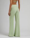 Green high-waisted trousers with a flared hem in stretch wool cloth 4