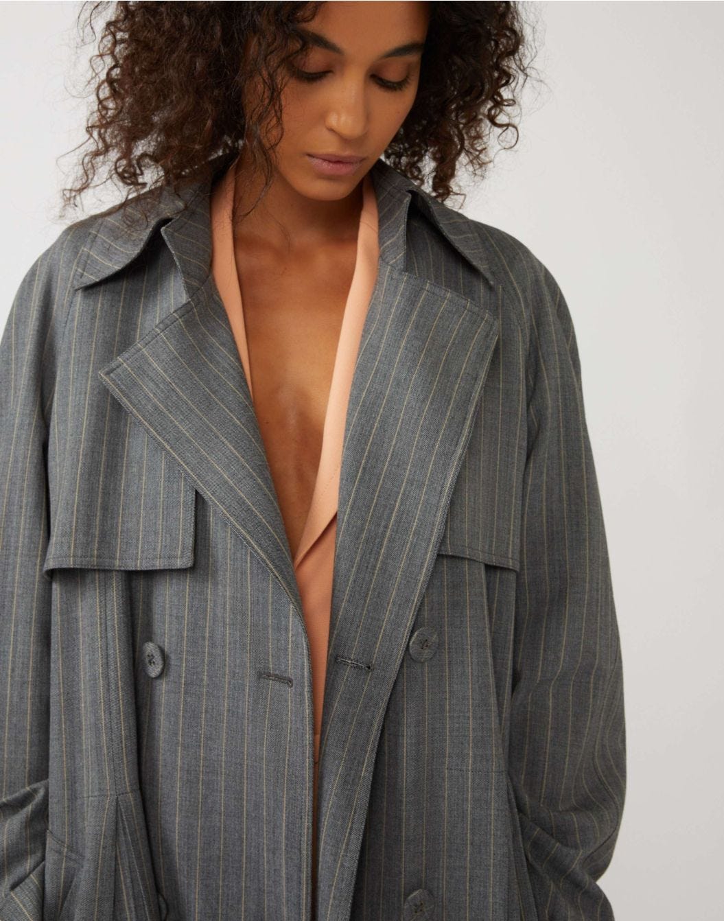 Double-breasted pinstripe trench coat in wool with a belt