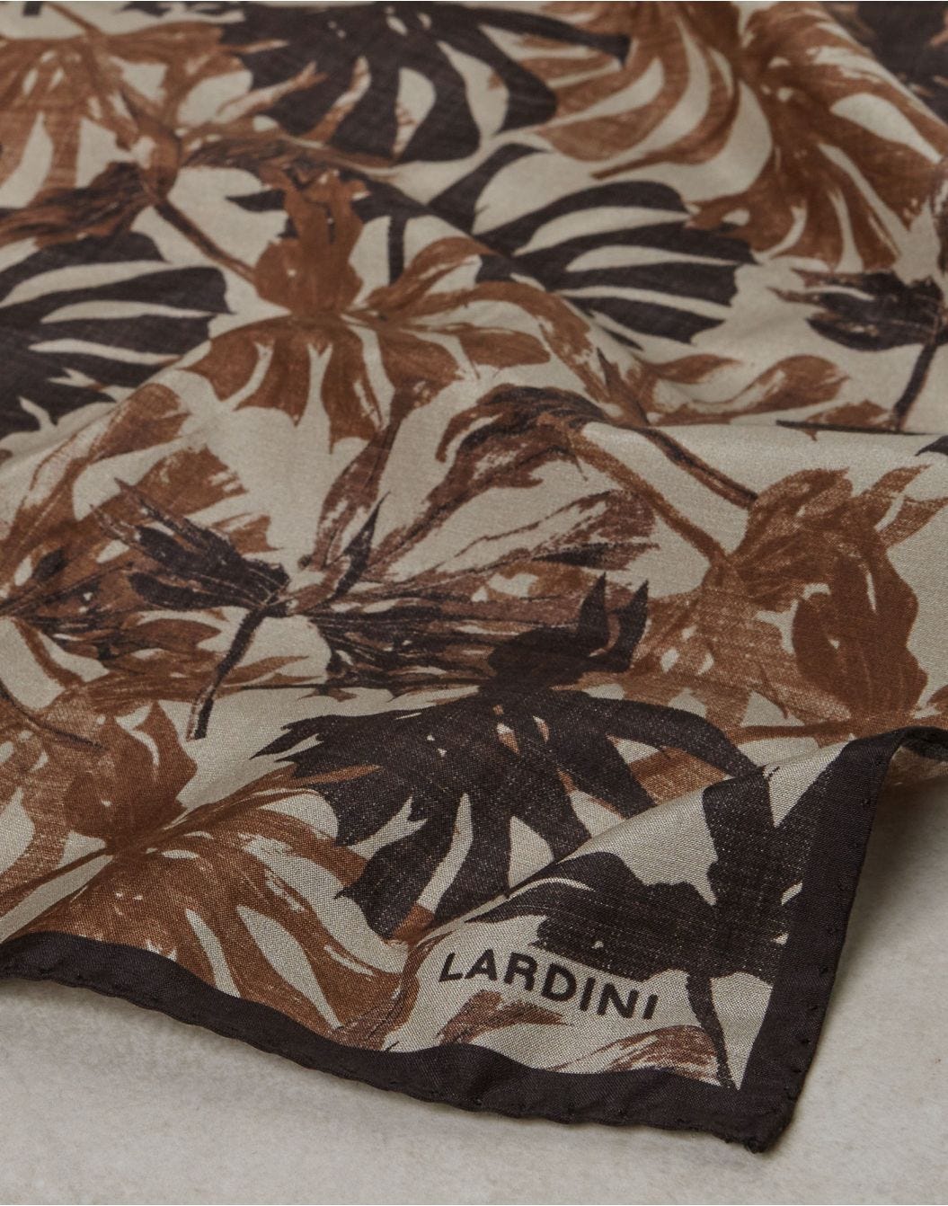 Brown linen and cotton pocket square with an exotic print