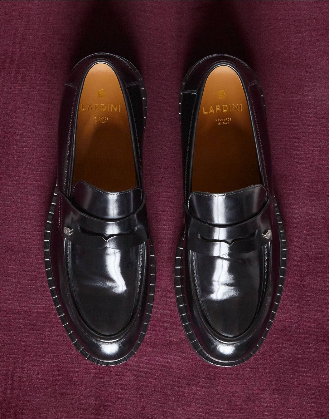 Black calfskin loafers with an apron.
