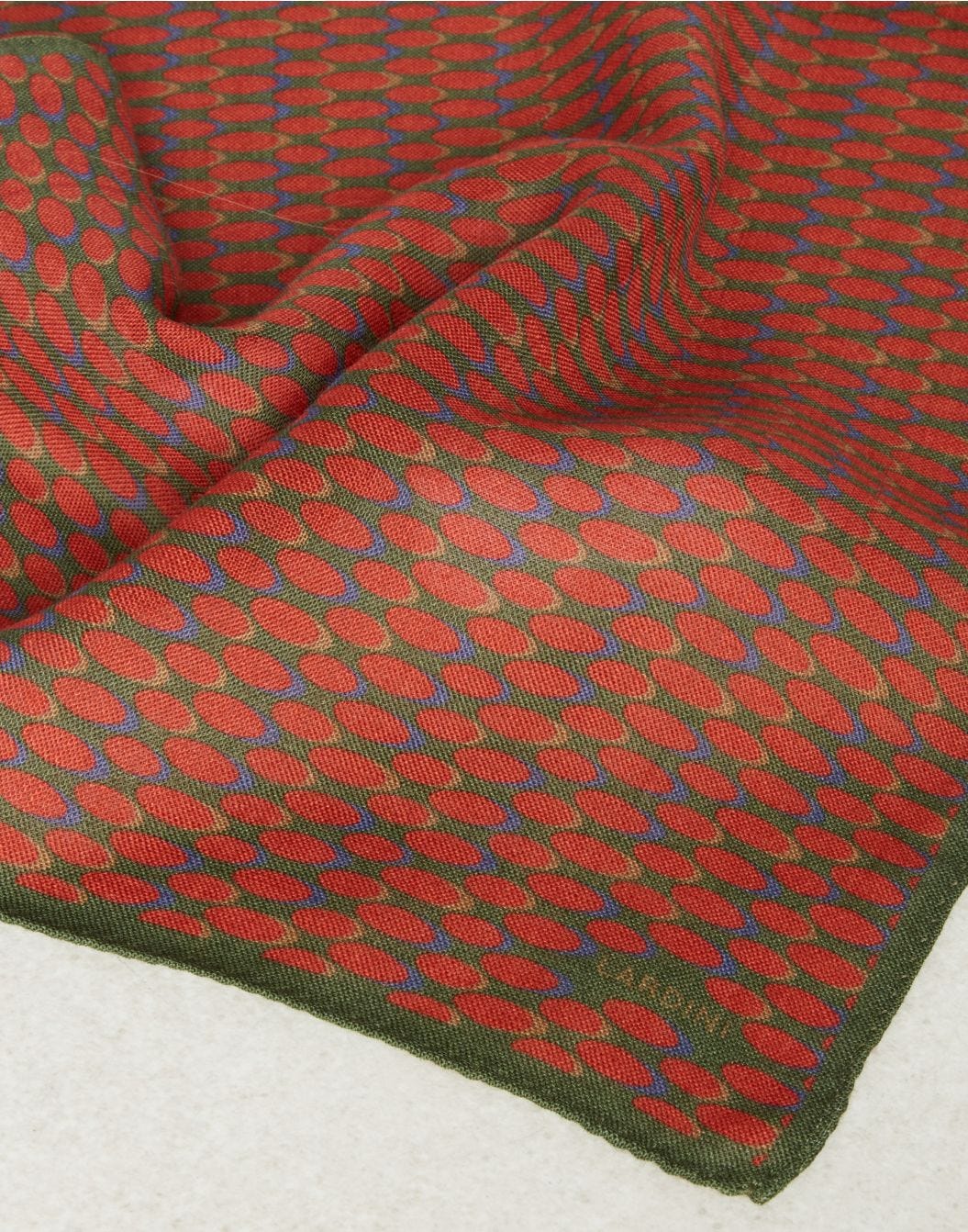 Pocket square in green and red wool with a geometrical pattern