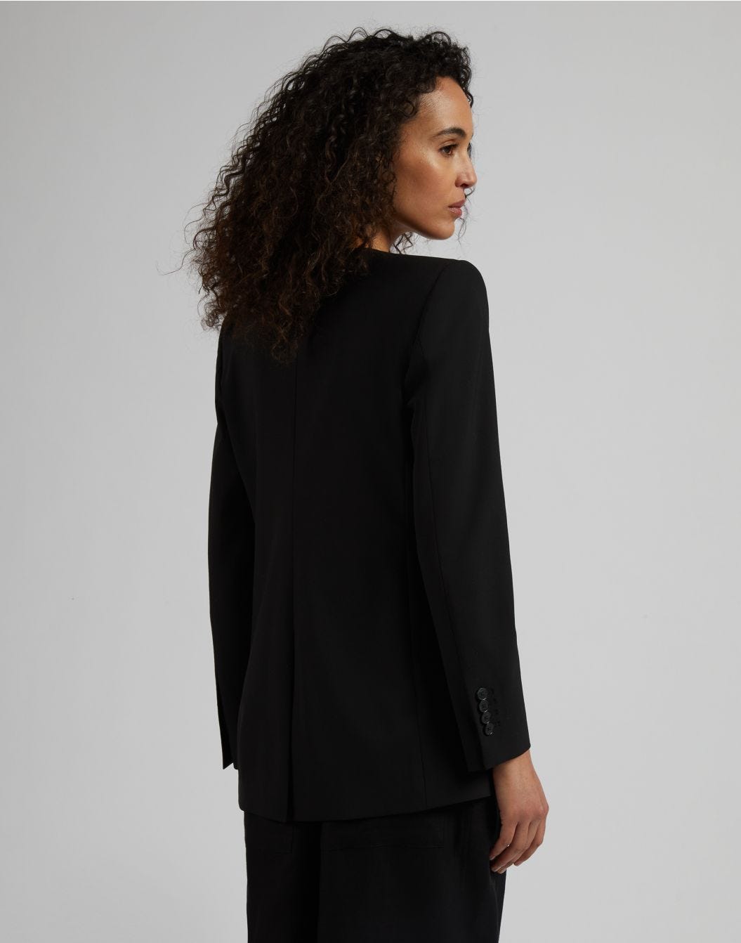 Black stretch wool cloth single-breasted collarless jacket