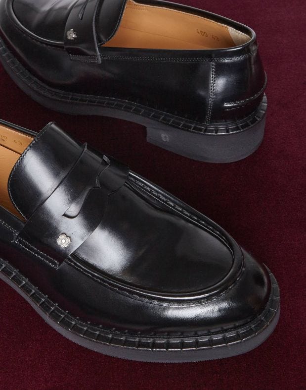 Black calfskin loafers with an apron.